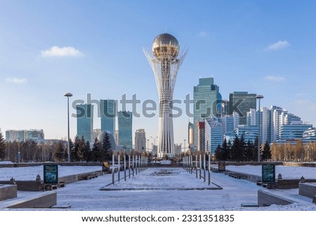 Panoramic view of Baiterek Tower on Nurjol Boulevard. Urban landscape of sunny winter day in city of Astana, Nur-Sultan, Kazakhstan. High quality photo
