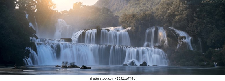 Panoramic View of Ban Gioc Waterfalls at Sunset, Vietnam – Majestic Cascades in Lush Forest Setting, Ideal for Nature and Travel Themes.Unesco site. - Powered by Shutterstock