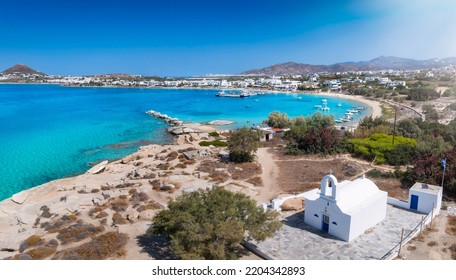 Panoramic view to the bay, beach and church of Agia Anna, Naxos island, Cyclades, Greece, with turquoise sea during summer time