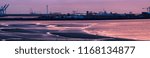 Panoramic view of beach while sunset