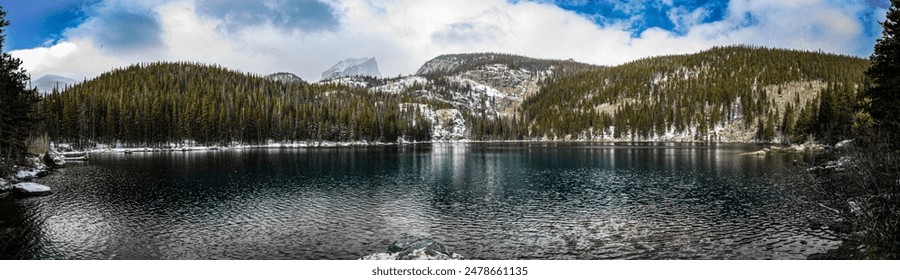 A panoramic view of Bear Lake surrounded by mountains covered with pine forest and snow in winter - Powered by Shutterstock