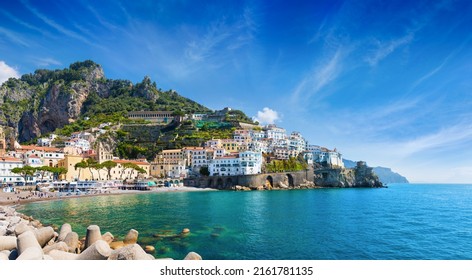 Panoramic view of beautiful Amalfi on hills leading down to coast, comfortable beaches and azure sea in Campania, Italy. Amalfi is most popular travel and holyday destination in Europe. - Shutterstock ID 2161781135