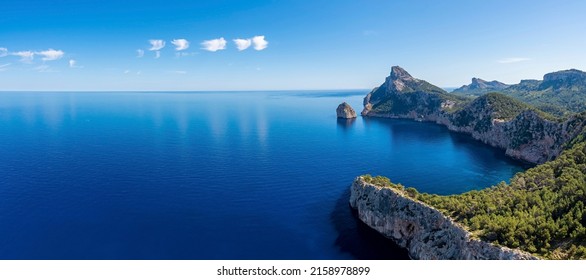 Panoramic view of beautiful Mediterranean seascape. Scenic Rocky cliffs on seaside against sky. Idyllic blue ocean at island in summer. - Powered by Shutterstock