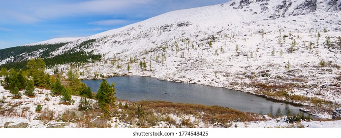 Panoramic view of beautiful mountain lake. Winter.