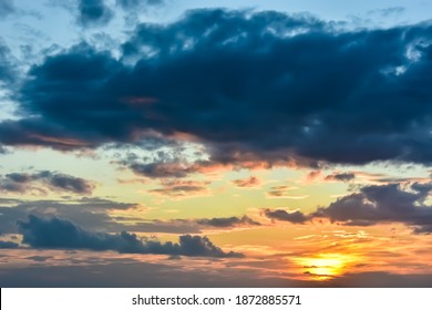 Panoramic view of beautiful sky during sunset over tropical island. Colorful sky with overcast cloud and glowing sunset in evening. Cloudy sky. Cloudscape and skyscape at Lipa Noi beach, Samui island.
