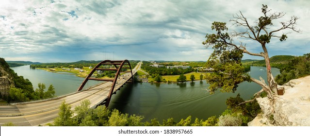 Panoramic view of the beautiful through arch Pennybacker Bridge in Austin, Texas on a cloudy stormy day.