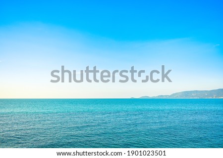 Panoramic view of blue calm sea and blue clear sky in the summer afternoon at the coast of a tropical island. Coastal landscape and seascape at Lipa Noi beach, Samui island, Thailand Selected focus