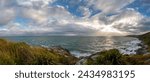 Panoramic view from Bluff Hill Motupohue, spectacular views over Foveaux Strait and and native forest, wind-battered coast and scrub-covered hillsides in Southland, New Zealand