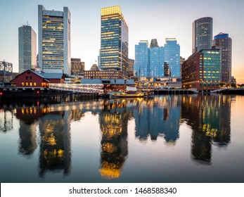 Panoramic View Of Boston In Massachusetts, USA At Sunset Showcasing Its Financial District At Seaport Boulevard.