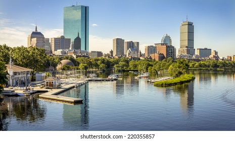 Panoramic view of Boston in Massachusetts, USA showcasing its mix of modern and historic architecture and the famous Charles River that cross the city on a hot summer day.
