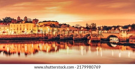 Panoramic view of the bridge and old town of Tavira in Algarve, Portugal
