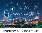 Panoramic view of Broadway district of Nashville over Cumberland River at illuminated night skyline, Tennessee, USA. Decentralized economy. Blockchain, cryptocurrency, cryptography concept, hologram