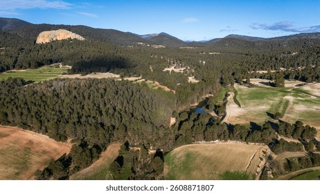 Panoramic view of the Burete mountain range in the Region of Murcia, with its pine forests, cultivated fields and Lake Manzano.