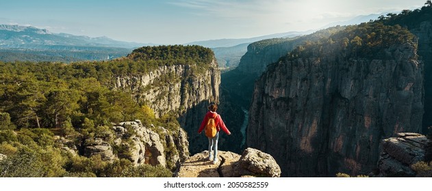 panoramic view of canyon national park in Turkey, banner image nature landscape, hiker woman standing on cliff and overlooking Tazi canyon