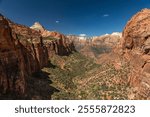 Panoramic View from the Canyon Overlook Trail into scenic Zion National Park on a perfect Summer Day with blue Sky