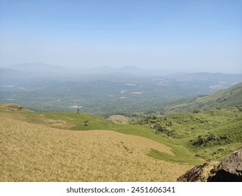 Panoramic view capturing mountainous terrain from a lofty, elevated perspective.