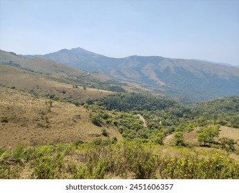 Panoramic view capturing mountainous terrain from a lofty, elevated perspective.