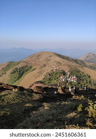 Panoramic view capturing mountainous terrain from a lofty, elevated perspective.