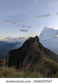 Panoramic view capturing mountainous terrain from a lofty, elevated perspective.