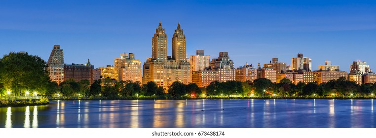 Panoramic view of Central Park West at dawn and the Jacqueline Kennedy Onassis Reservoir. Upper West Side, Manhattan, New York City - Shutterstock ID 673438174
