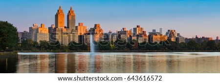 Panoramic view of Central Park West high-rise buildings and the Jacqueline Kennedy Onassis Reservoir at dawn. Upper West Side, Manhattan, New York City