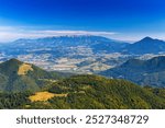 Panoramic view from Chleb summit. Vysoke Tatry (Rohace) mountains and Velky Choc peak in the background. Mala Fatra, Slovak republic, Europe