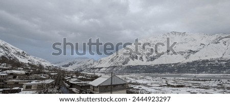 Panoramic view of a city covered with snow. This city is known as Chitral which is located in northern area of Pakistan, District KPK. It is well known for its mountainous ranges and iconic views.