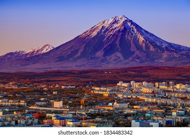 Panoramic view of the city Petropavlovsk-Kamchatsky and volcanoes: Selective focus. Koryaksky Volcano, Avacha Volcano, Kozelsky Volcano. Russian Far East, Kamchatka Peninsula. - Powered by Shutterstock