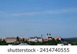 panoramic view of the city of Veszprem, Hungary. summer scene with lush green hill side and the castle district. historical place with many church towers and the fortress. stone walls. historic town.