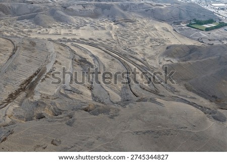 Panoramic view of a clay quarry undergoing geological exploration and zoning prior to exploitation.