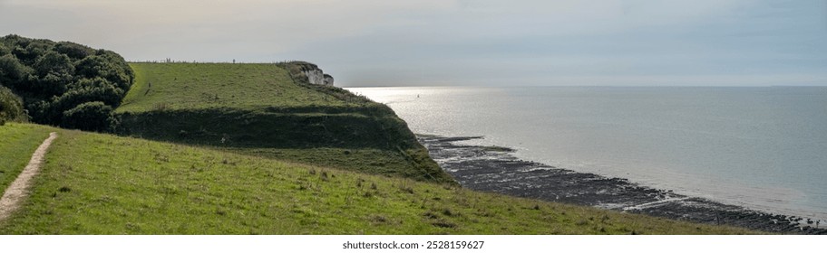 Panoramic view of Cliffs, pastures, meadows and the sea from coastal path - Powered by Shutterstock