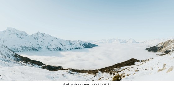 Panoramic view with cloud inversion and snowy mountains, Sainte Foy Tarentaise, France