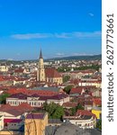 Panoramic View of Cluj-Napoca with the Towering Gothic St. Michael’s Church Dominating the Cityscape — A Vivid Display of Architectural Heritage, Rooftops, and Urban Charm in the Heart of Transylvania