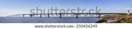 Panoramic view of Confederation Bridge with Borden-Carleton lighthouse from Prince Edward Island, Canada