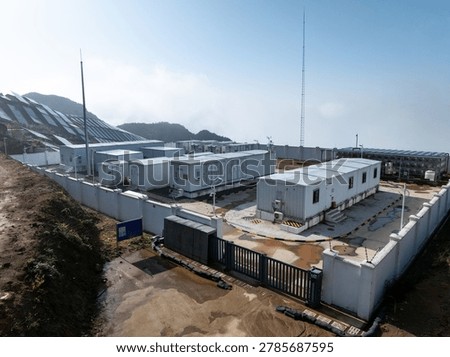 Panoramic view of containerized energy storage power station facility in mountain area