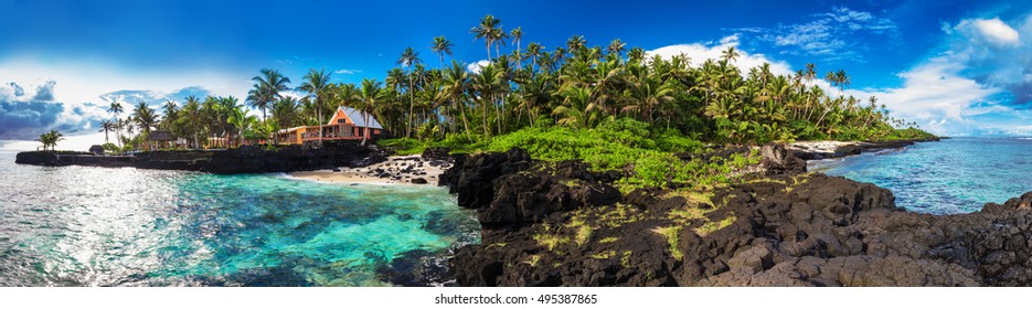 Panoramic view of coral reef and palm trees on south side of Upolu, Samoa Islands.