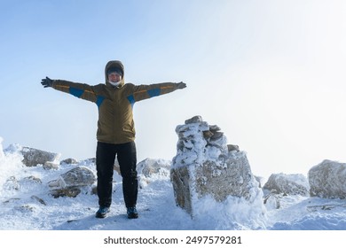 A panoramic view of the covered with snow trees in the snowdrifts. Magical winter forest. Nature winter landscape.