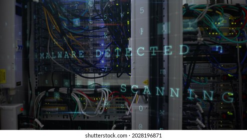 Panoramic view of data server center with warnings of cyber attack from a computer screen.