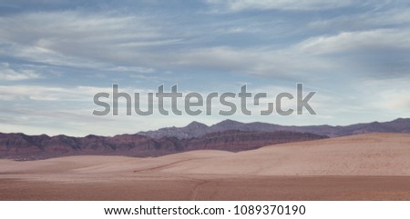 panoramic view death valley with some mountains on the back 