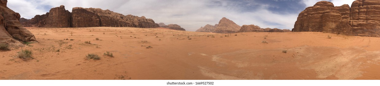 Panoramic View Of The Desert Plains Of Wadi Rum In Jordan At Noon