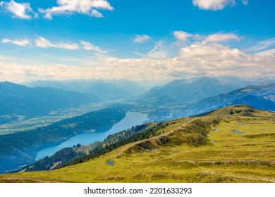 Panoramic view of Drava river valley, Lake Millstatt and small ponds known as the eyes of Mirnock on top of Mount Mirnock 2,110 m., Nock Mountains, Gurktal Alps, Austria.