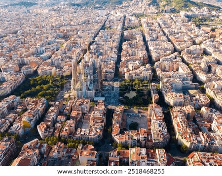Panoramic view from drone of Eixample district and Sagrada Familia in Barcelona at sunny summer day