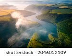 Panoramic view from a drone flying over the meander of the Dniester river. Location place Dnister canyon of Ukraine, Europe. World landmarks. Picturesque photo wallpaper. Discover the beauty of earth.