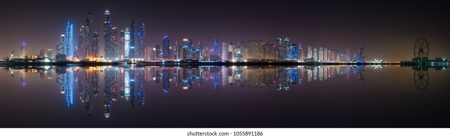 Panoramic View Of Dubai Marina Skyline With Reflection At Night, UAE