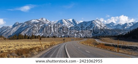 Panoramic view of Eastern Sierra mountains , scenic highway heading towards the mountains.