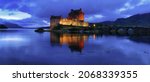 Panoramic view of Eileen Donan Castle at Dusk on the Shores of Loch Duich, West Highlands, Scotland, UK.