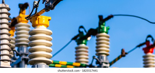Panoramic view Electric power transmission lines in the evening. High voltage switchgear and equipment of power plant. - Shutterstock ID 1825517441