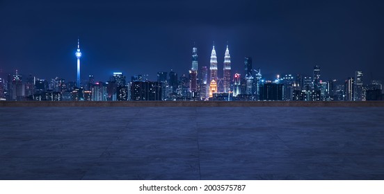 Panoramic view of empty concrete floor of rooftop with city skyline, Night scene - Shutterstock ID 2003575787
