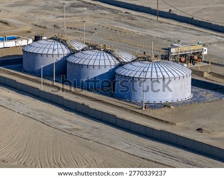 Panoramic view of enormous API tanks for sulfuric acid storage for the mining industry