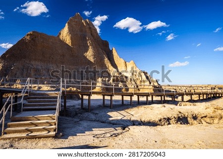 Panoramic view of eroded rock formation peaks along the Door Trail at Badlands National Park, South Dakota